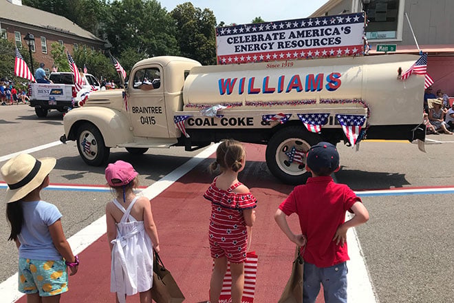 Williams Energy vintage tanker truck in a South Shore Fourth of July parade with children watching
